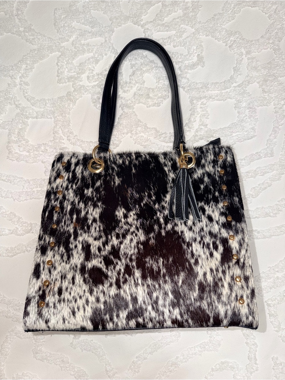 Spotted Black & White Cowhide Tote Bag with Tassel